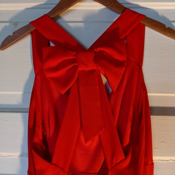 Open Back Bow dress with black mini skirt. - Picture 5 of 8